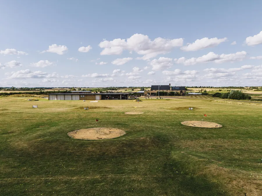 The range from the air, target greens in front of the range building and clubhouse
