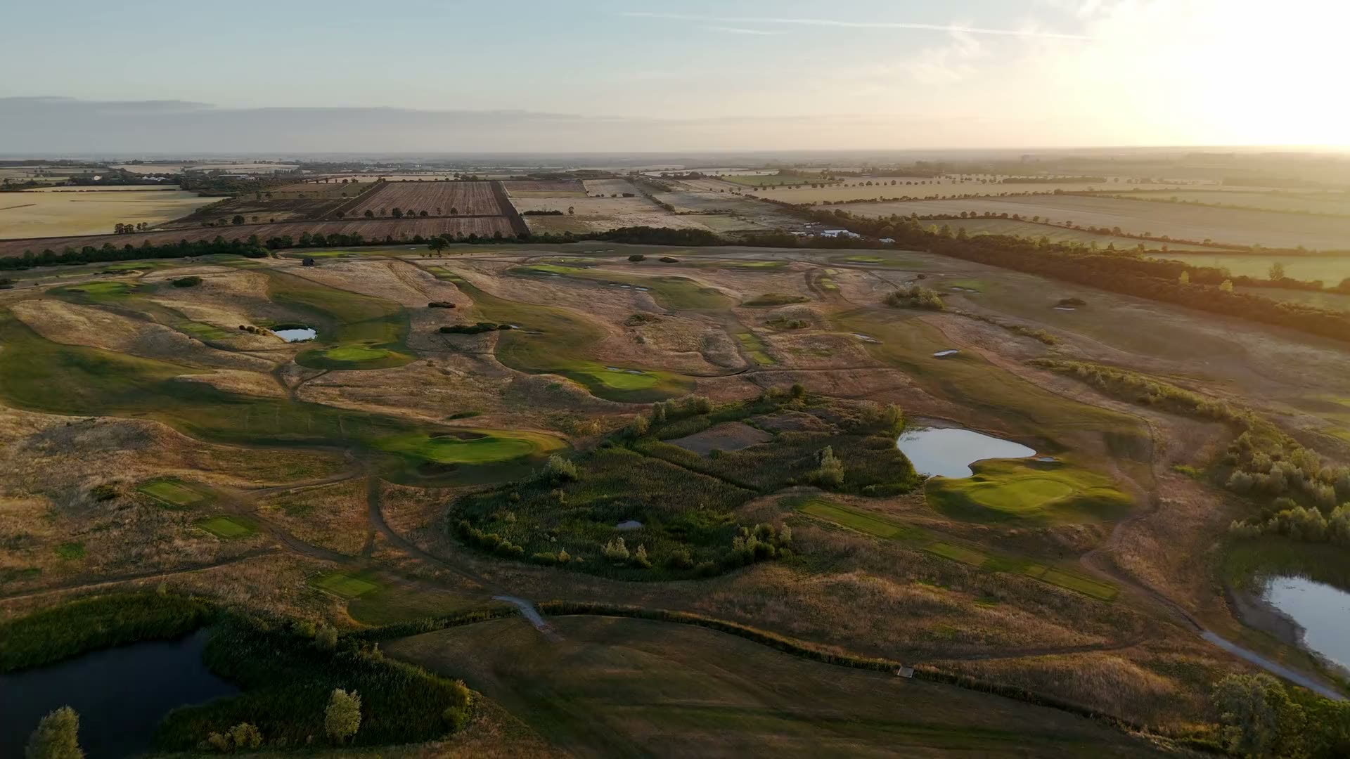 The course from the air at dawn, the Cambridgeshire fields beyond