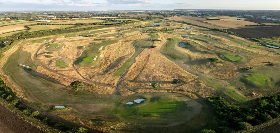Rolling links ground in gold, from the air