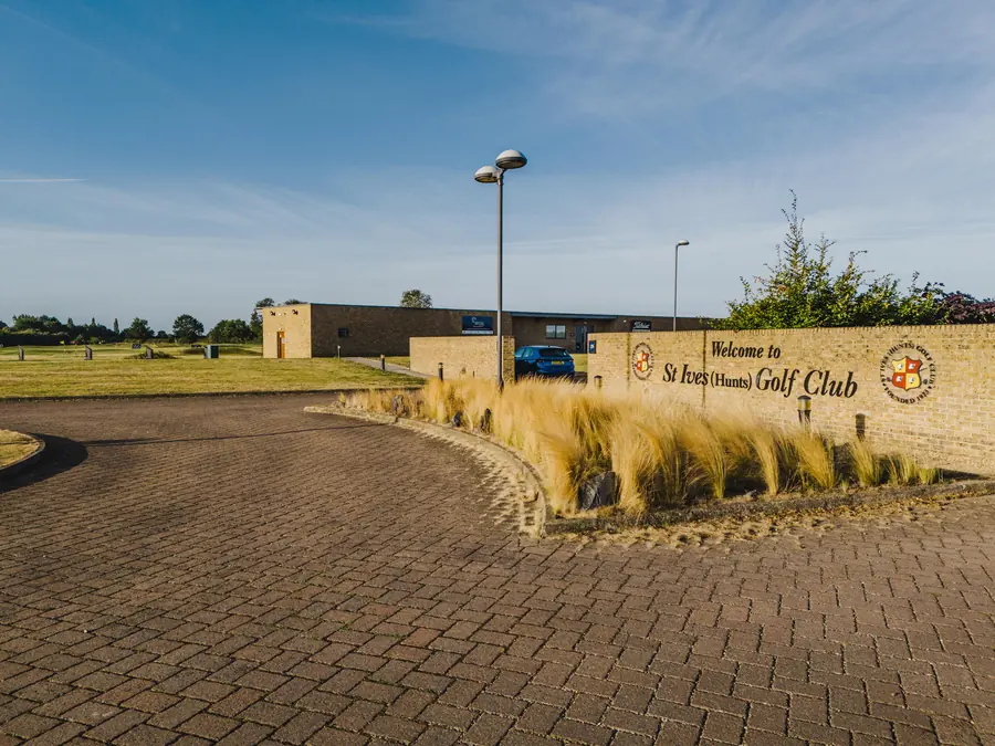 The club's entrance sign and drive