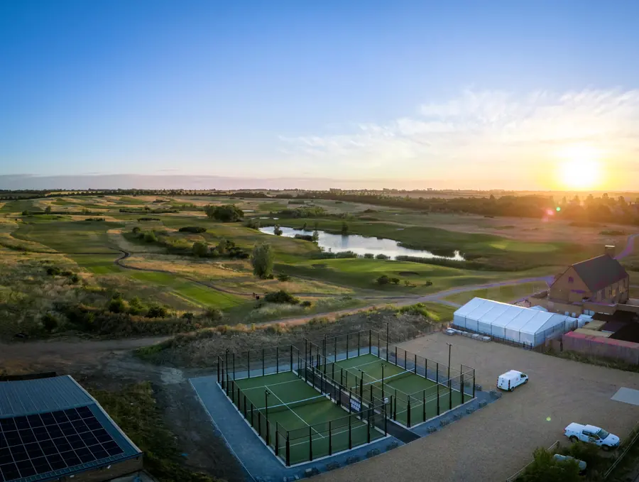 The padel courts and clubhouse at sunrise